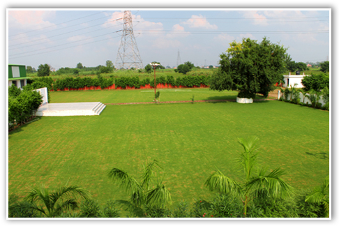 Stage and party lawn view at Pari Farm
